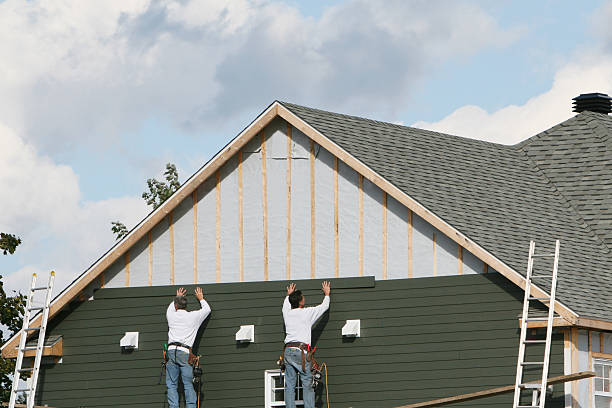 Professional Vinyl Siding technician working in Chelsea, MA